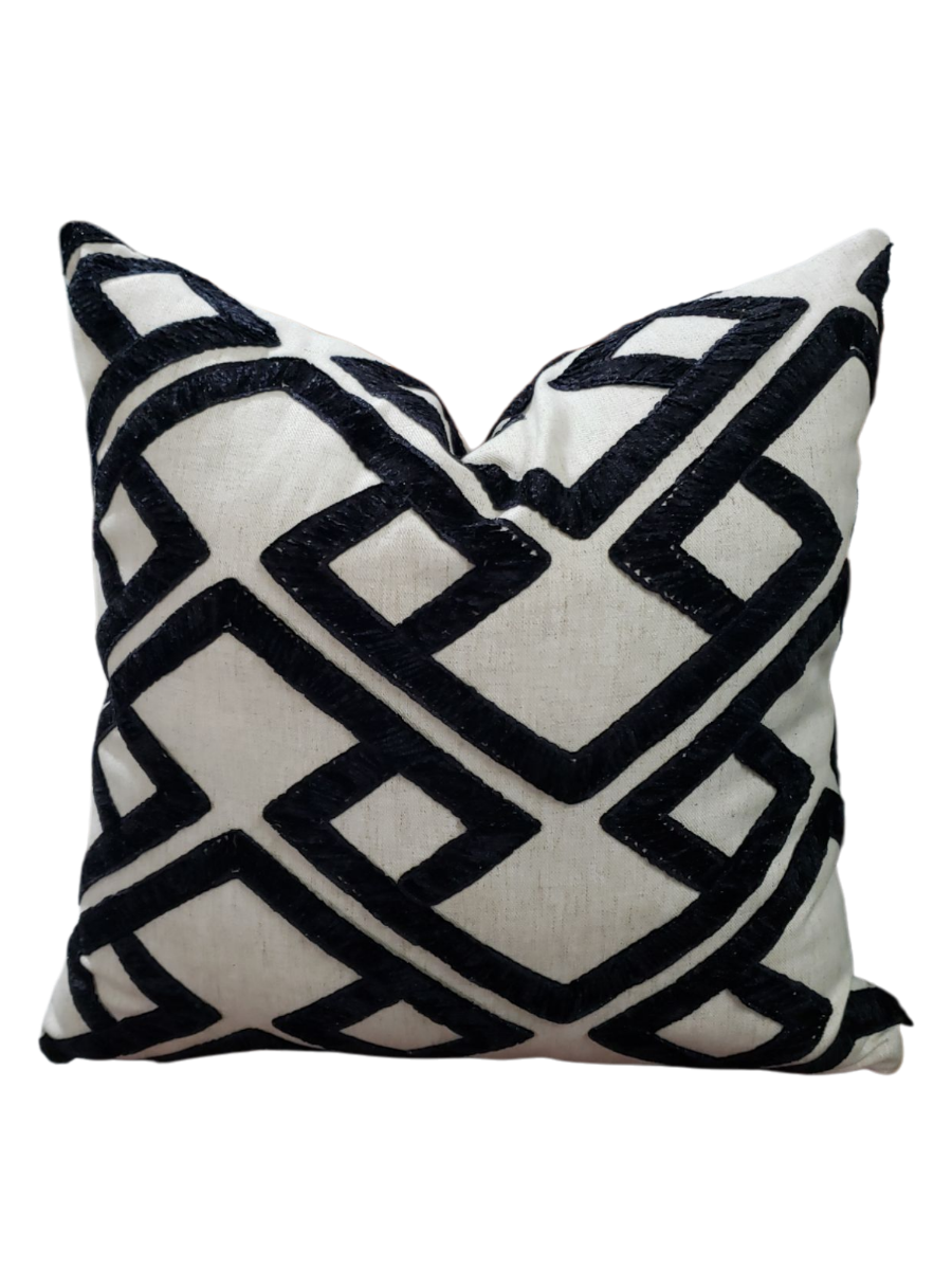 Elevate your home decor with the Kimberly Melanoid Pillow Cover. Made from designer PKaufmann accolade fabric, this handcrafted cover features a trendy black and off-white geometric design with a textured finish. Revamp your space with this stylish and unique addition.