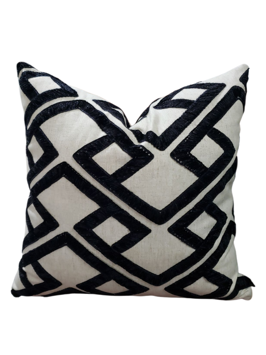 Elevate your home decor with the Kimberly Melanoid Pillow Cover. Made from designer PKaufmann accolade fabric, this handcrafted cover features a trendy black and off-white geometric design with a textured finish. Revamp your space with this stylish and unique addition.
