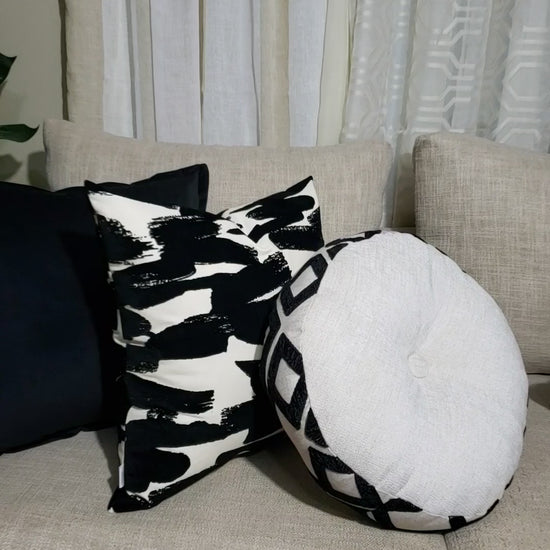 Add a bold and stylish touch to your home decor with this luxurious black pillow cover. Made with high-quality microsuede designer fabric, its flanged edges provide an elegant look while also making it versatile for any room. Make a statement and enhance your living space with this must-have accessory.