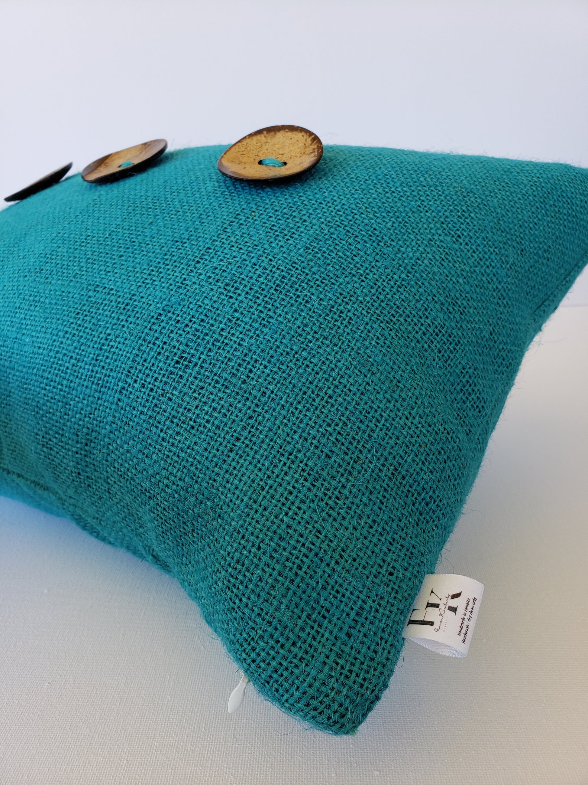 Introducing a luxurious addition to your home decor - the Coastal Teal Burlap Decorative Pillow Cover. Made from the finest Teal burlap fabric, accented with large coconut buttons and meticulously lined and double stitched by designer Fiona Kimberly. Transform your space with a touch of boho coastal elegance.
Advenique Home Decor 