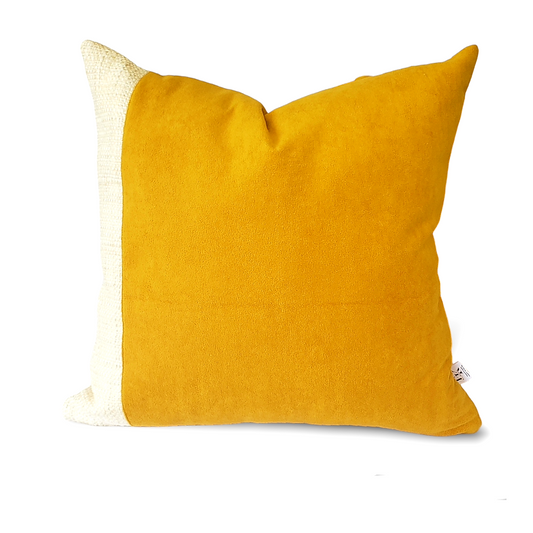 Elevate your home decor with our Fiokim Mustard Deluxe Square Pillow Cover. Crafted with luxurious mustard suede-like fabric, this designer pillow features a sophisticated woven ivory and beige design. Perfect for your sofa or bedroom, its matching reverse and double stitched, sealed edges add a touch of elegance. The invisible zipper ensures a seamless and polished look.