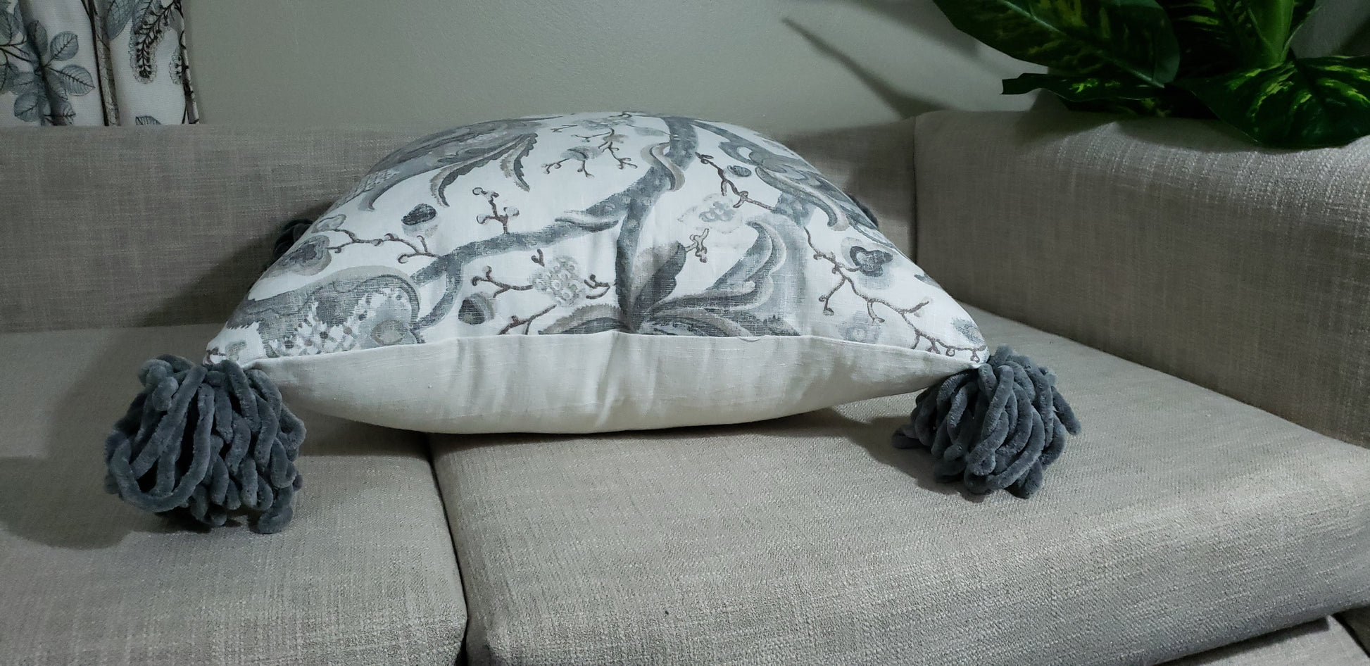 Transform an ordinary couch into an inviting sanctuary with our Grey Serenity Decorative Cushion Cover. Crafted with luxurious, soft linen blend fabric and eye-catching chunky tassels, it adds unique sophistication to your home. Enjoy the beauty and comfort of the designer throw pillow's muted colors and make your living space a peaceful oasis. Experience the lavish lifestyle!
 
Highlights 

Made from Diantha Grey P Kaufmann Fabric

Hand-made 

Unique design

