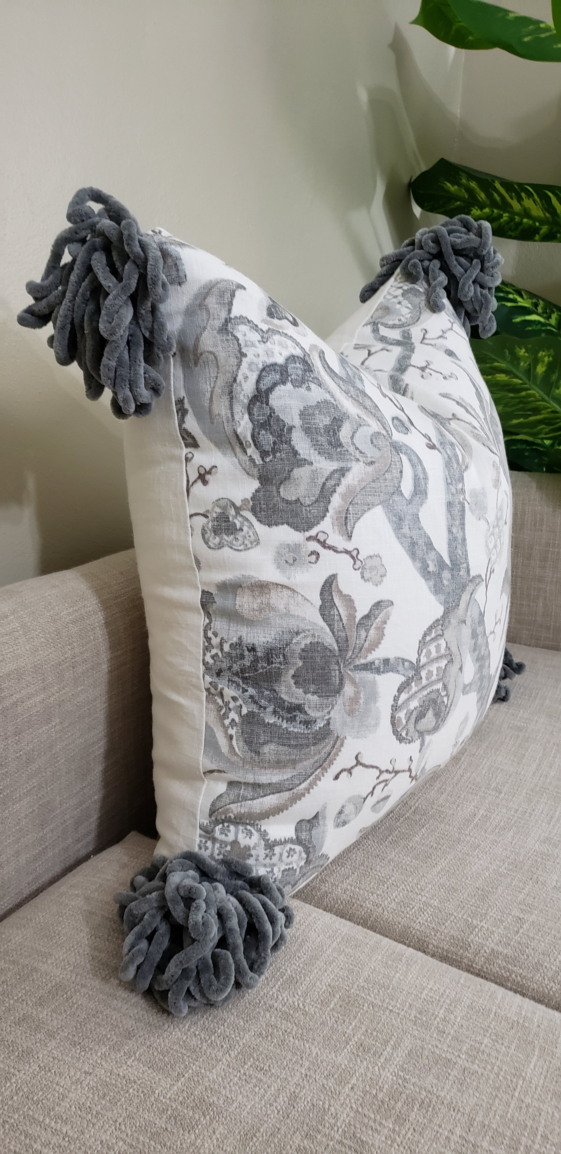 Transform an ordinary couch into an inviting sanctuary with our Grey Serenity Decorative Cushion Cover. Crafted with luxurious, soft linen blend fabric and eye-catching chunky tassels, it adds unique sophistication to your home. Enjoy the beauty and comfort of the designer throw pillow's muted colors and make your living space a peaceful oasis. Experience the lavish lifestyle!
 
Highlights 

Made from Diantha Grey P Kaufmann Fabric

Hand-made 

Unique design

