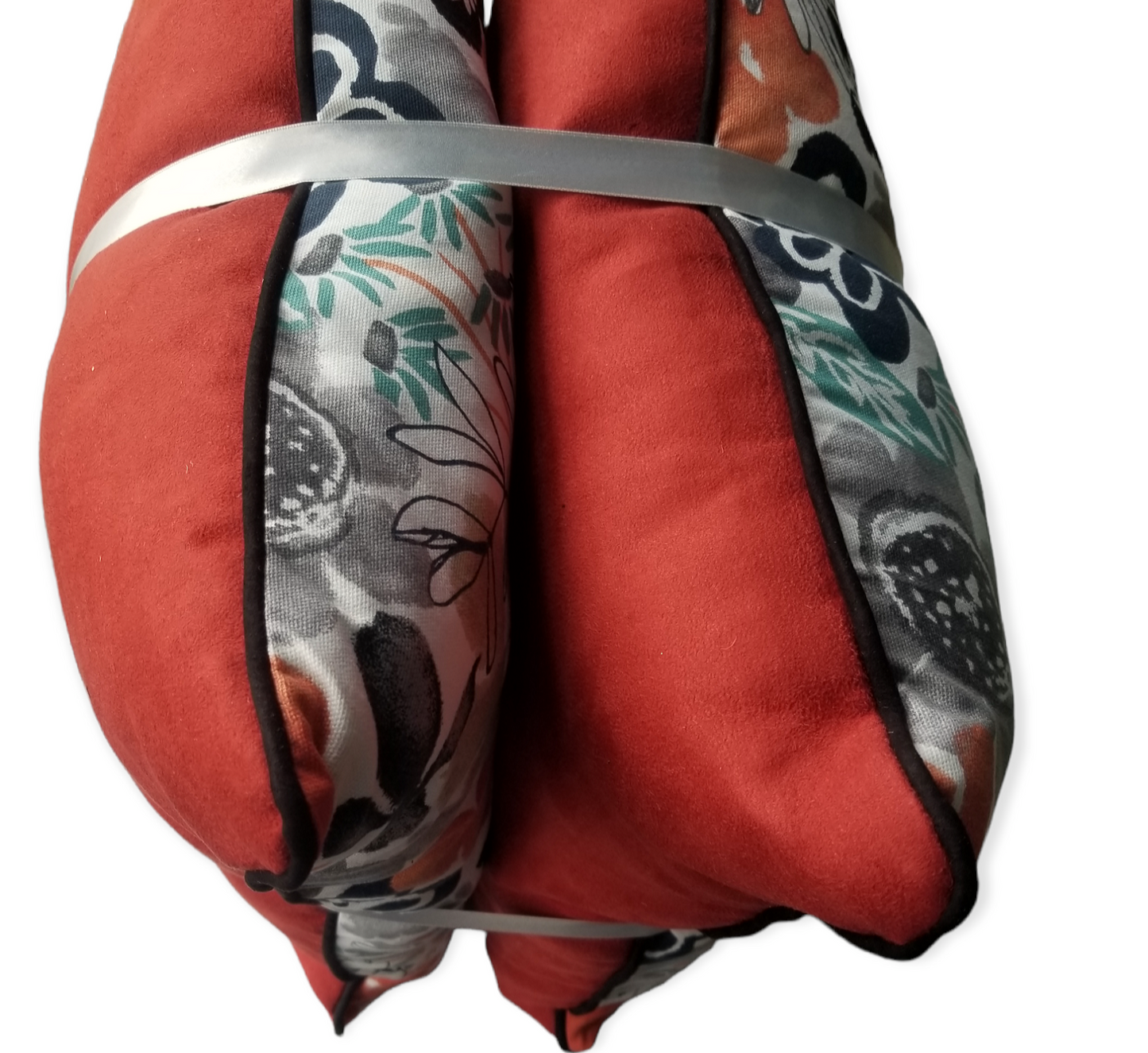 This vibrant yet relaxing designer accent pillow boasting colors such as teal, black, grey and orange.  perfect for your bedroom, livingroom or foyer.  eleganty and carefully crafted to give the highest quality finish and luxury to last for years to come.  Complete with an invisible zipper, solid teal microfiber back and piped edge.