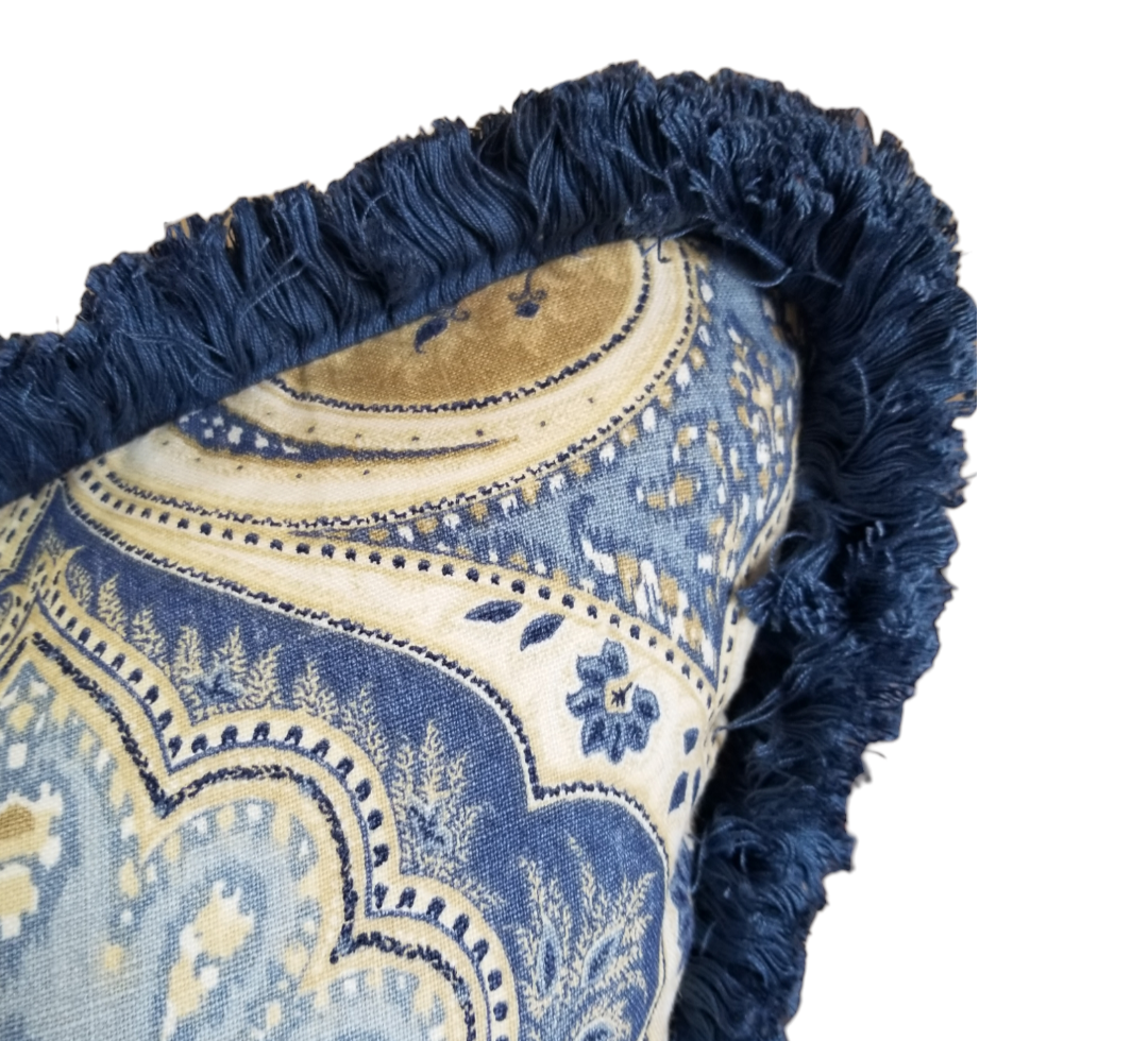 This designer throw pillow is perfect for sprucing up any living room or bedroom. Crafted from Kravet Lakita Delta indigo fabric, it features a classic Paisley pattern in muted blue and white hues to create a timeless look. The 100% linen construction ensures lasting durability and comfort, while the hidden zipper closure allows for easy removal of the pillow cover for cleaning. This designer throw pillow is sure to make a stylish impact in any setting.